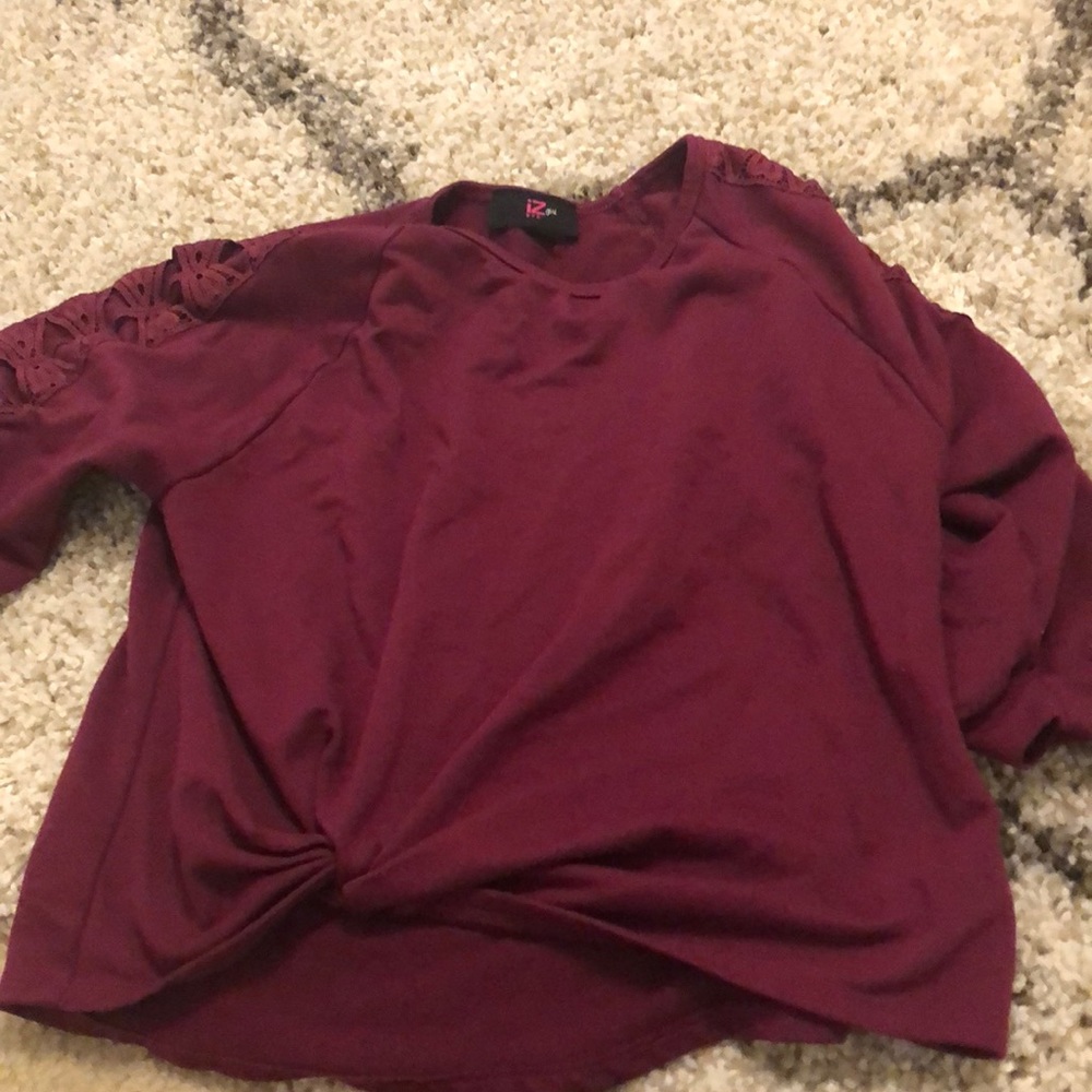 A dark pink long sleeve shirt
